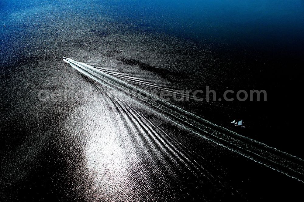 Loissin from the bird's eye view: Sport Boat in motion on the water surface in Greifswalder Bodden of Baltic - Sea in Loissin in the state Mecklenburg - Western Pomerania