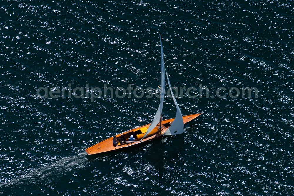 Aerial image Starnberger See - Sports boat sailing ship with white sails on the journey on Lake Starnberg in the state Bavaria, Germany