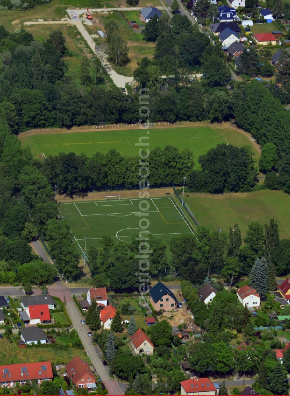 Aerial image Neuenhagen - View of the sports fields and some houses in Neuenhagen in the state Brandenburg