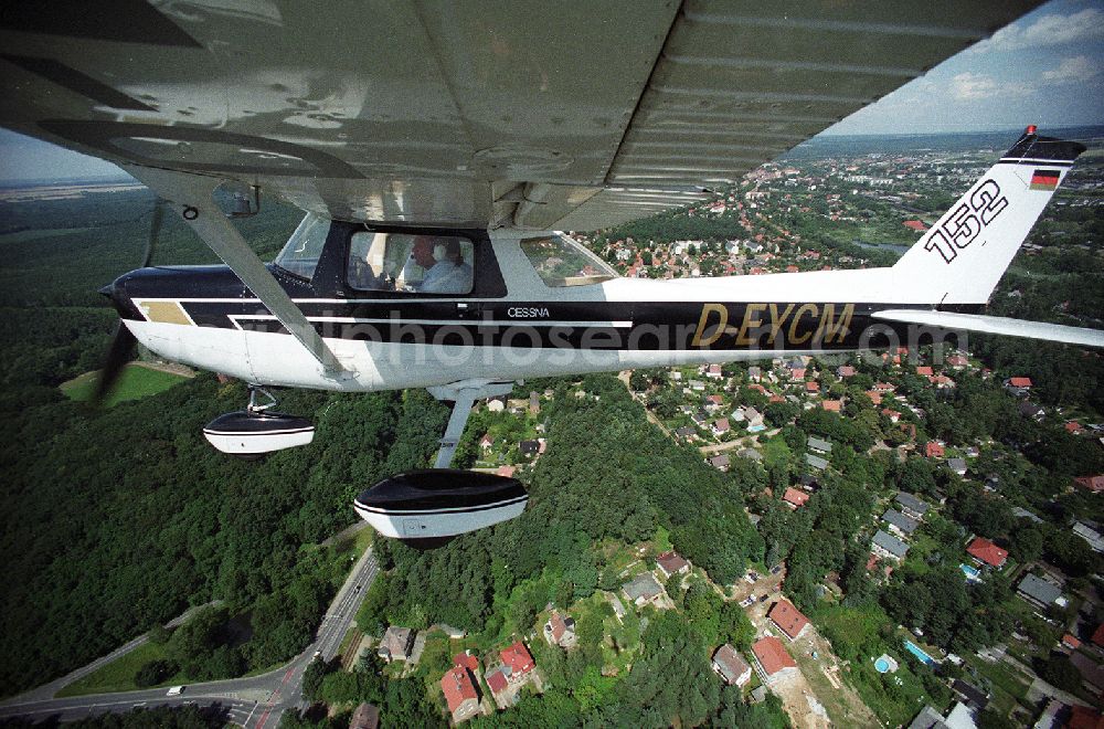 Aerial photograph Strausberg - Sport airplane Cessna 152 flight school AERO TOURS - PEGASUS after starting on the airfield Strausberg in Brandenburg