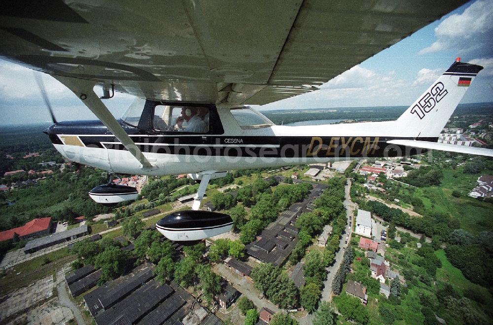 Strausberg from above - Sport airplane Cessna 152 flight school AERO TOURS - PEGASUS after starting on the airfield Strausberg in Brandenburg