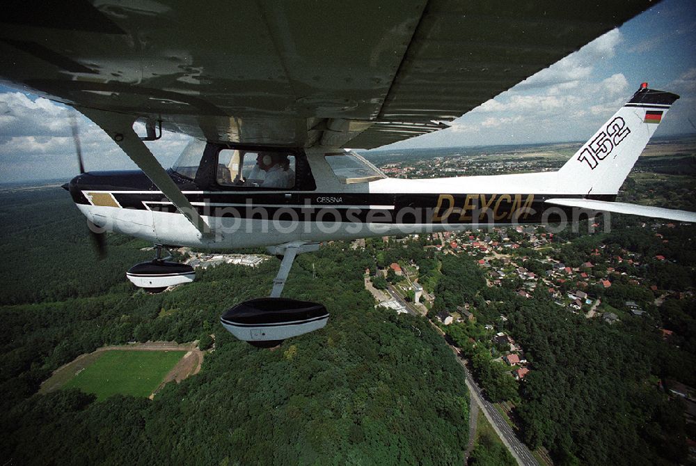 Aerial image Strausberg - Sport airplane Cessna 152 flight school AERO TOURS - PEGASUS after starting on the airfield Strausberg in Brandenburg