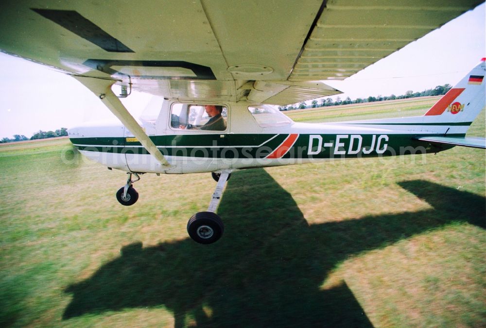 Bienenfarm Paulinenaue from the bird's eye view: Sport airplane Cessna 150 after starting at the airfield Bienenfarm - Paulinenaue in Brandenburg