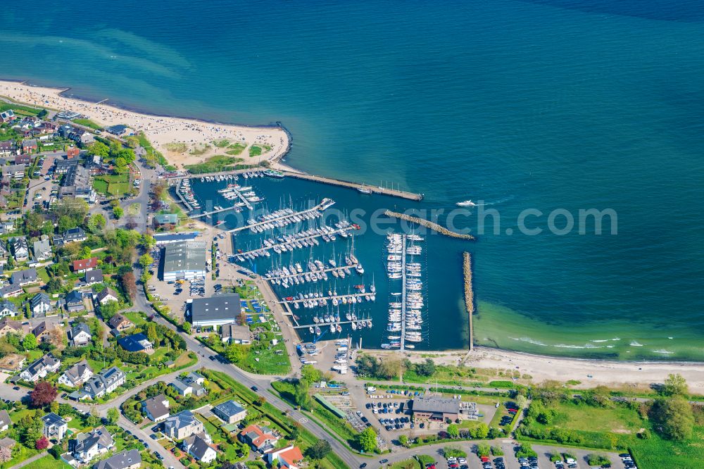 Strande from above - Sports harbor in the Baltic Sea -Bad Strande near Kiel in the state Schleswig-Holstein, Germany. Home port of the KYC ( Kiel Yacht Club ) on Strandstrasse in Strande with a residential area and sandy beaches