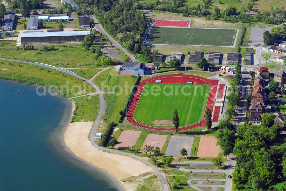 Berlin from the bird's eye view: Blick auf den Sportpark Süd mit dem städtischen Stadion am Goitzschesee. Das Stadion ist die Heimspielstätte vom VfL Eintracht Bitterfeld, es verfügt über eine Kapazität von 2000 Stehplätzen. Kontakt: VfL Eintracht Bitterfeld 1992 e.V., Sportpark Süd, Ortsteil Bitterfeld, Niemegker Strasse 19, 06749 Bitterfeld-Wolfen, Tel. & Fax 03493 41243, E-Mail: webmaster@vfl-eintracht-bitterfeld.de,