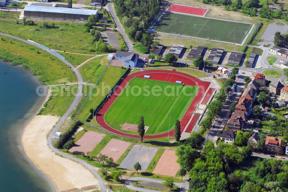 Aerial image Berlin - Blick auf den Sportpark Süd mit dem städtischen Stadion am Goitzschesee. Das Stadion ist die Heimspielstätte vom VfL Eintracht Bitterfeld, es verfügt über eine Kapazität von 2000 Stehplätzen. Kontakt: VfL Eintracht Bitterfeld 1992 e.V., Sportpark Süd, Ortsteil Bitterfeld, Niemegker Strasse 19, 06749 Bitterfeld-Wolfen, Tel. & Fax 03493 41243, E-Mail: webmaster@vfl-eintracht-bitterfeld.de,