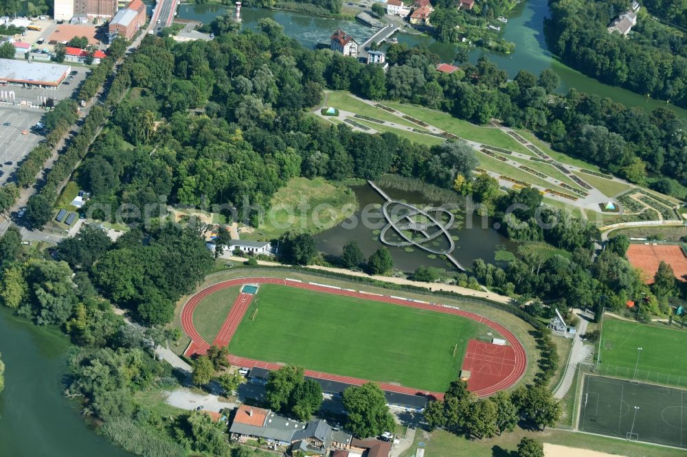 Aerial photograph Rathenow - Sports grounds and football pitch of the BSC Rathenow 1994 e.V. mit dem Optikpark im Hintergrund in Rathenow in the state Brandenburg