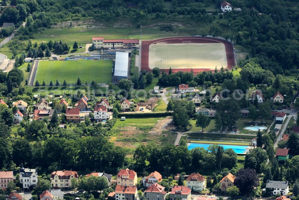 Sondershausen from the bird's eye view: The Sports Centre Am Goeldner in Sondershausen in Thuringia is located in the south of the city. The sports complex consists of a football stadium and an artificial turf field with a track and field facility. The BSV Eintracht Sondershausen eV uses the venues for training and sporting events and has his office here. The outdoor swimming pool Sonnenblick is located on the Cannabichstraße with swimming pool and paddling pool