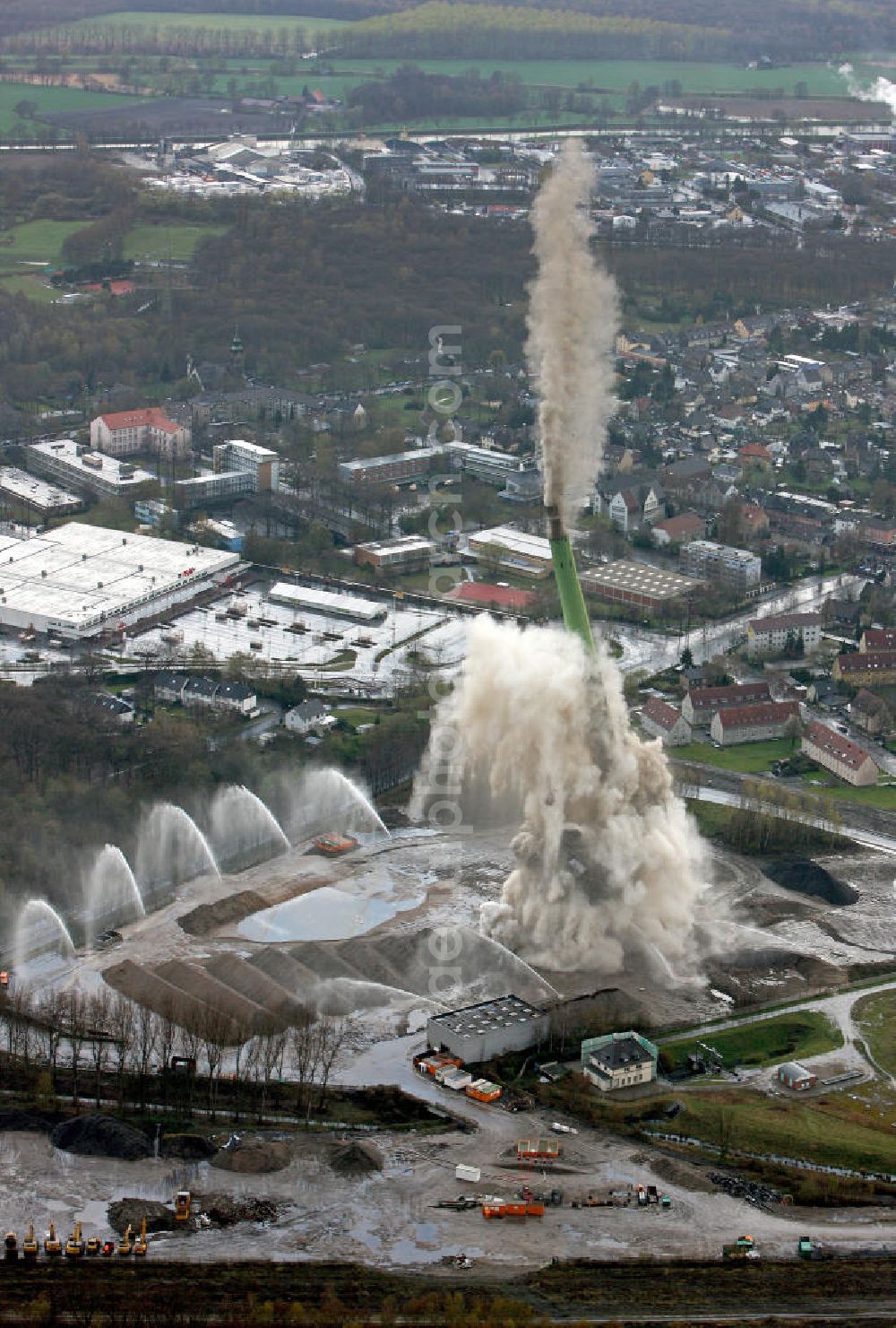 Aerial image Castrop-Rauxel - Sprengung des 230 m hohen Schornsteins auf dem E.ON-Kraftwerksgelände in Castrop-Rauxel. Die Sprengung des mehr als 7000 Tonnen wiegenden Schornsteins war eine der letzten Maßnahmen des 2006 begonnenen Kraftwerks-Rückbaus. Demolition of the 230 m high chimney on the E. ON power plant site in Castrop-Rauxel. The blowing up of more than 7,000 tons weighing chimney was one of the last measures of the power plant decommissioning which began in 2006.