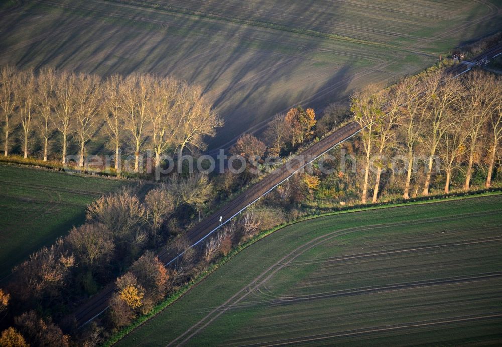 Werneuchen from above - Late autumn landscape along the field and tree rows on the railway line on the outskirts of Werneuchen in Brandenburg