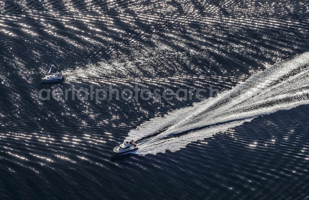 Aeroe from above - Tracks of yachts during journey on the sea water surface in Aeroe in Syddanmark, Denmark