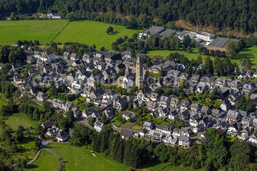 Schmallenberg from the bird's eye view: The church St.-Alexan der in the city centre of Schmallenberg in the state North Rhine-Westphalia. The parish church with its noticeable steeple is located on the Kirchplatz in the centre of the town