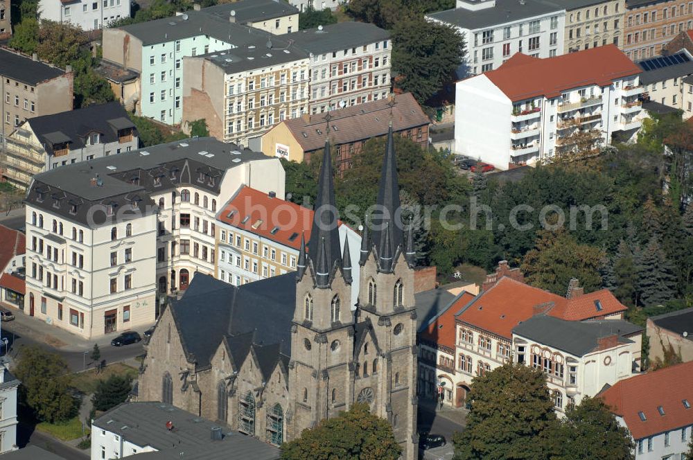 Magdeburg from the bird's eye view: Blick auf die evangelische St. Ambrosius Kirche am Ambrosiusplatz im Stadtteil Sudenburg. Die dreischiffige Kirche mit Querschiff ist 1875 im Stil der Neugotik errichtet. Kontakt: St. Ambrosius, Pfarrer: Conrad Herold / Propst Dr.Matthias.Sens, Halberstädter Str. 132, 39112 Magdeburg, Tel. +49(0)391 604729