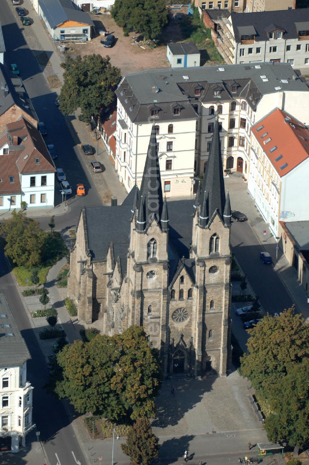 Aerial image Magdeburg - Blick auf die evangelische St. Ambrosius Kirche am Ambrosiusplatz im Stadtteil Sudenburg. Die dreischiffige Kirche mit Querschiff ist 1875 im Stil der Neugotik errichtet. Kontakt: St. Ambrosius, Pfarrer: Conrad Herold / Propst Dr.Matthias.Sens, Halberstädter Str. 132, 39112 Magdeburg, Tel. +49(0)391 604729