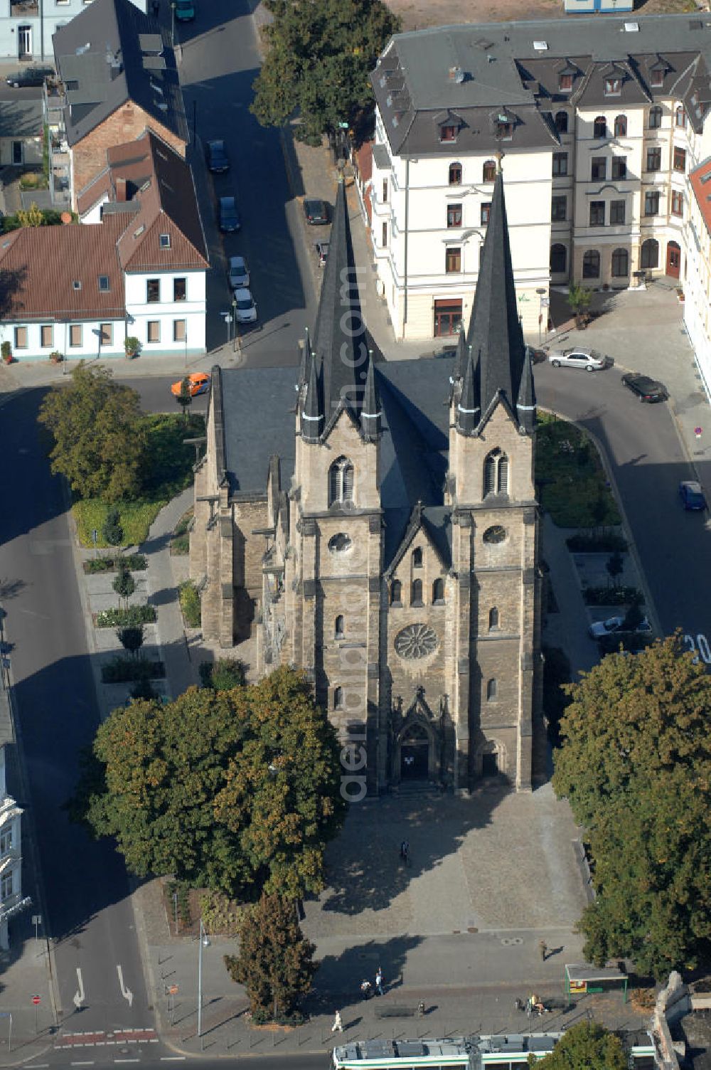 Aerial photograph Magdeburg - Blick auf die evangelische St. Ambrosius Kirche am Ambrosiusplatz im Stadtteil Sudenburg. Die dreischiffige Kirche mit Querschiff ist 1875 im Stil der Neugotik errichtet. Kontakt: St. Ambrosius, Pfarrer: Conrad Herold / Propst Dr.Matthias.Sens, Halberstädter Str. 132, 39112 Magdeburg, Tel. +49(0)391 604729