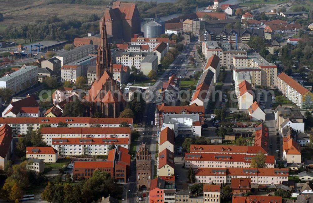 Demmin from the bird's eye view: Blick auf die gotische St. Bartholomaei-Kirche am Kirchplatz 7 in 17109 Demmin - das Wahrzeichen der Hansestadt. Ansprechpartner: Gemeindebüro Tel.: 03998/433483. Im Hintergrund befinden sich die Getreidespeicher am Peenehafen.