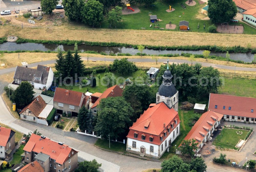 Nordhausen from the bird's eye view: In the district Sundhausen of Nordhausen in Thuringia is close to the river Helme the village church of St. Lawrence. The church was built in the 18th century in the Baroque style