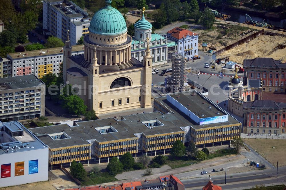 Aerial image Potsdam - The Old Market of Potsdam in Brandenburg fascinates with its historic building ensemble. Striking feature is the dome of St. Nicholas Church, which was built in the classical style designed by Karl Friedrich Schinkel. The city castle Potsdam was built in the last few years back and is now the seat of the Parliament of Brandenburg. In the background, the old town hall and the Knobelsdorff house can be seen. In the new building in the foreground, the departments of Information Science and Social Studies of college Potsdam are housed. At the time of recording, the obelisk was scaffolded on the old Mark