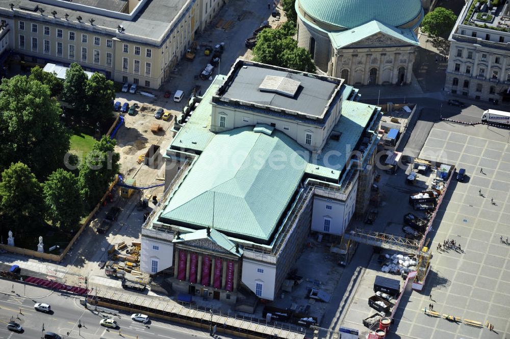 Berlin from the bird's eye view: Staatsoper Unter den Linden, auch Deutsche Staatsoper oder Staatsoper Berlin genannt, zur Zeit der Sanierung, in Berlin-Mitte. Es ist das älteste Opernhaus und Theatergebäude in Berlin. Das Gebäude ist zwischen 2010 und 2013 für die Sanierungsarbeiten geschlossen. Beauftragt damit wurde das Stuttgarter Architektenbüro HG Merz. Staatsoper Unter den Linden, also called Berlin State Opera or german state opera, currently under reconstruction, in Berlin-Mitte. It is the oldest opera house and theatre building in Berlin and closed from 2010 to 2013 due to the renovation works.The Stuttgarter architects office HG Merz has been charged with the task.