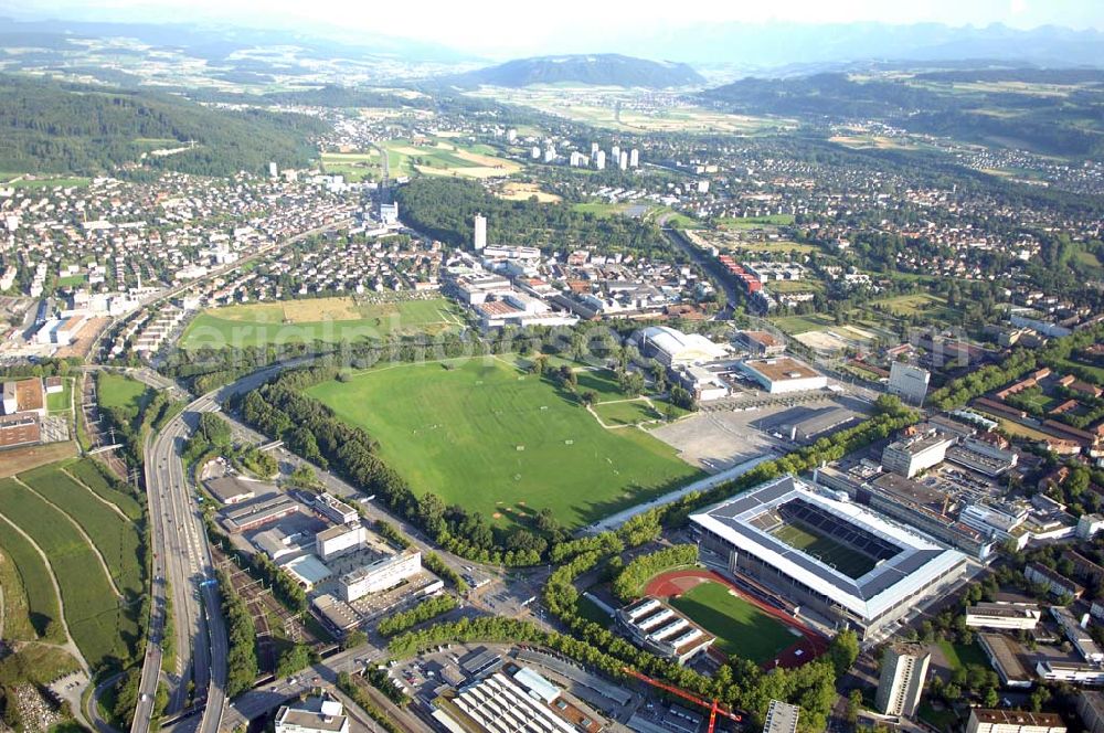 Aerial image Bern - Das Stadion Stade de Suisse Wankdorf Bern steht im Wankdorfquartier der Stadt in der Schweiz. Die Arena ist Heimstatt des Berner Fussballvereins BSC Young Boys (YB) und wurde durch die Baufirma Marazzi Generalunternehmung ( heute Losinger Construction AG) und die Baltensperger AG errichtet.