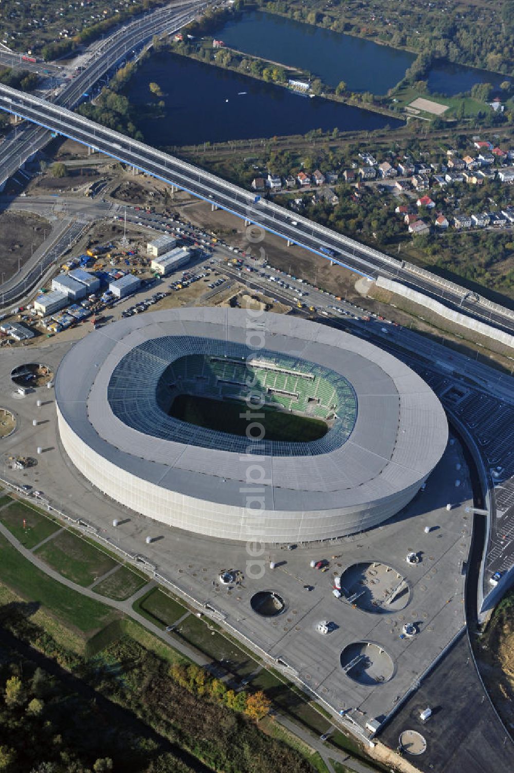 Wroclaw / Breslau from the bird's eye view: Das neu errichtete Stadion Miejski in Breslau, Niederschlesien in Polen. Das Fußballstadion ist ein Austragungsort der UEFA Fußball-Europameisterschaft EM 2012. Errichtet wurde der Stadion- Neubau durch das Bauunternehmen MAX Bögl nach Entwürfen des deutschen Architekturbüros JSK. The new built stadium Miejski in Wroclaw, Lower Silesia in Poland. The soccer stadium is a venue for the UEFA European Football Championship 2012. The stadium was built by the construction company Max Bögl designed by the German architects JSK.