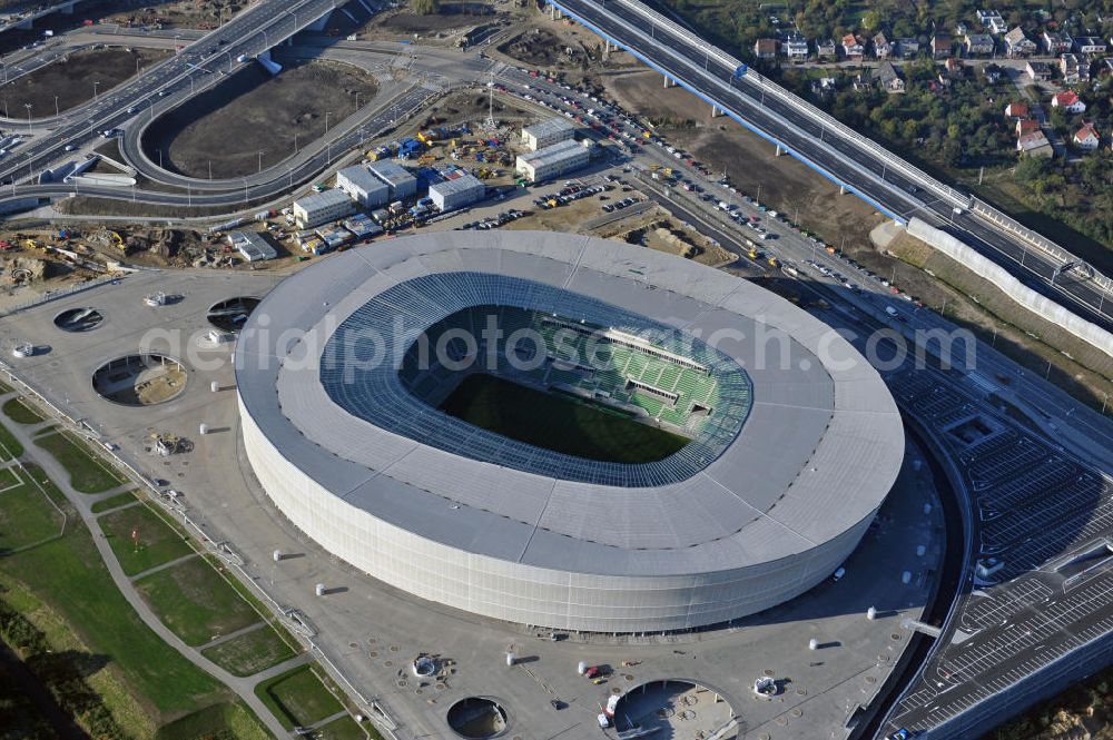 Aerial image Wroclaw / Breslau - Das neu errichtete Stadion Miejski in Breslau, Niederschlesien in Polen. Das Fußballstadion ist ein Austragungsort der UEFA Fußball-Europameisterschaft EM 2012. Errichtet wurde der Stadion- Neubau durch das Bauunternehmen MAX Bögl nach Entwürfen des deutschen Architekturbüros JSK. The new built stadium Miejski in Wroclaw, Lower Silesia in Poland. The soccer stadium is a venue for the UEFA European Football Championship 2012. The stadium was built by the construction company Max Bögl designed by the German architects JSK.