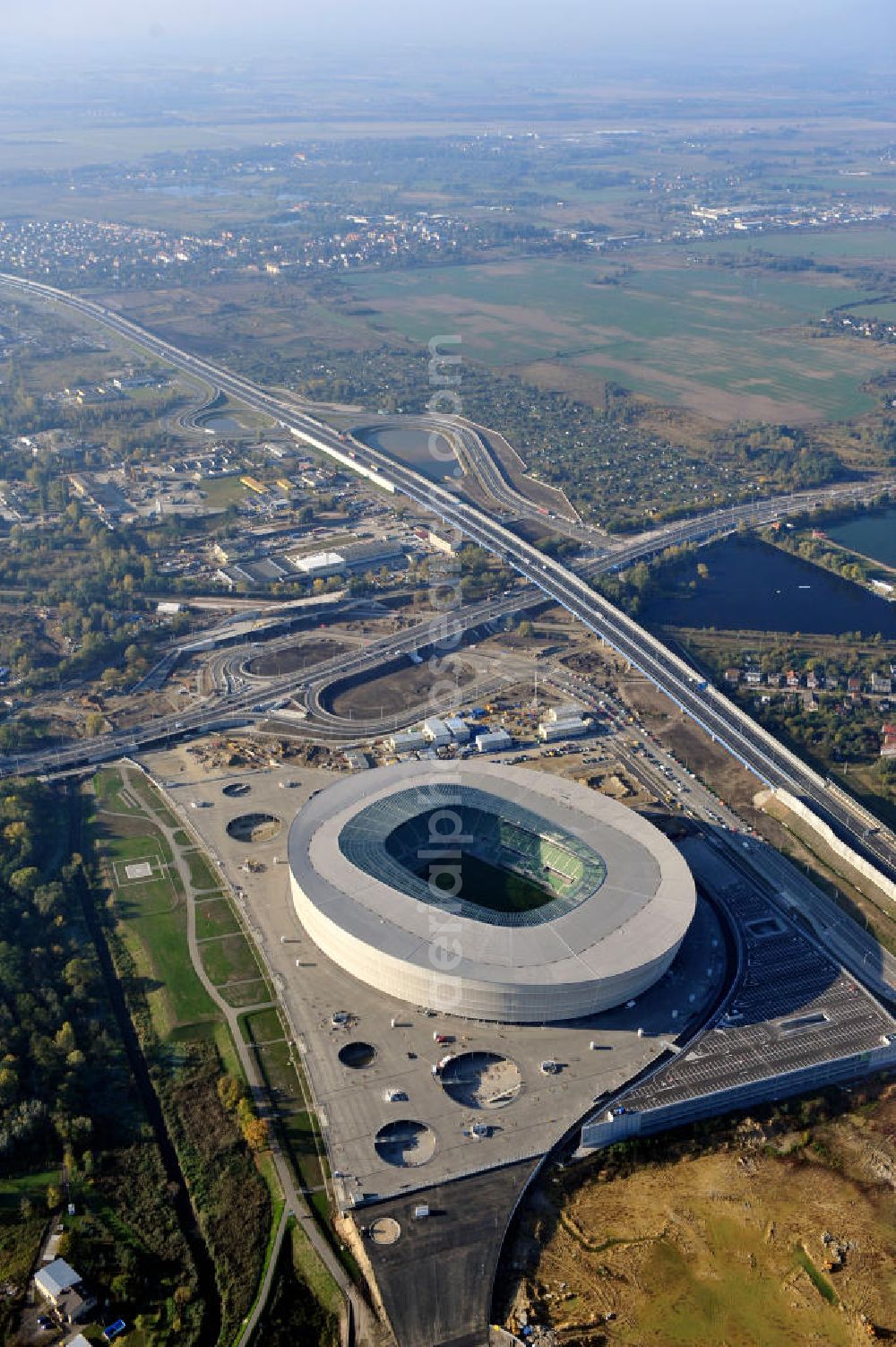 Wroclaw / Breslau from the bird's eye view: Das neu errichtete Stadion Miejski in Breslau, Niederschlesien in Polen. Das Fußballstadion ist ein Austragungsort der UEFA Fußball-Europameisterschaft EM 2012. Errichtet wurde der Stadion- Neubau durch das Bauunternehmen MAX Bögl nach Entwürfen des deutschen Architekturbüros JSK. The new built stadium Miejski in Wroclaw, Lower Silesia in Poland. The soccer stadium is a venue for the UEFA European Football Championship 2012. The stadium was built by the construction company Max Bögl designed by the German architects JSK.