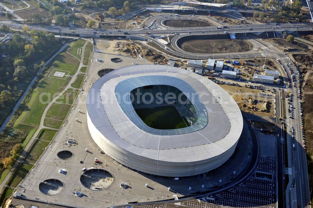 Aerial image Wroclaw / Breslau - Das neu errichtete Stadion Miejski in Breslau, Niederschlesien in Polen. Das Fußballstadion ist ein Austragungsort der UEFA Fußball-Europameisterschaft EM 2012. Errichtet wurde der Stadion- Neubau durch das Bauunternehmen MAX Bögl nach Entwürfen des deutschen Architekturbüros JSK. The new built stadium Miejski in Wroclaw, Lower Silesia in Poland. The soccer stadium is a venue for the UEFA European Football Championship 2012. The stadium was built by the construction company Max Bögl designed by the German architects JSK.