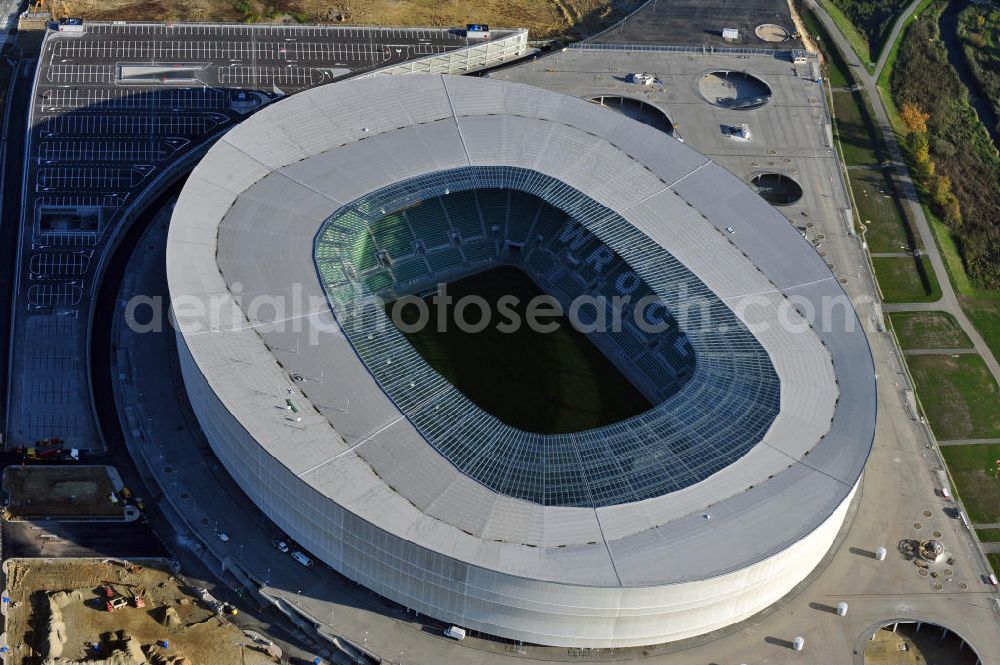 Wroclaw / Breslau from the bird's eye view: Das neu errichtete Stadion Miejski in Breslau, Niederschlesien in Polen. Das Fußballstadion ist ein Austragungsort der UEFA Fußball-Europameisterschaft EM 2012. Errichtet wurde der Stadion- Neubau durch das Bauunternehmen MAX Bögl nach Entwürfen des deutschen Architekturbüros JSK. The new built stadium Miejski in Wroclaw, Lower Silesia in Poland. The soccer stadium is a venue for the UEFA European Football Championship 2012. The stadium was built by the construction company Max Bögl designed by the German architects JSK.