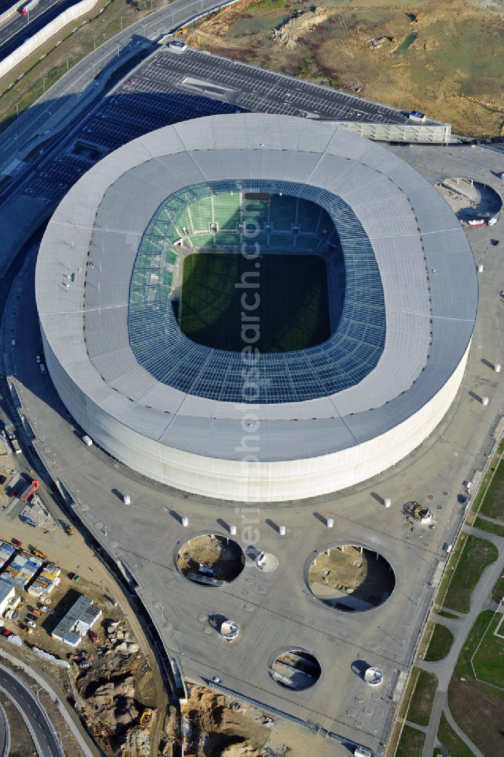 Aerial image Wroclaw / Breslau - Das neu errichtete Stadion Miejski in Breslau, Niederschlesien in Polen. Das Fußballstadion ist ein Austragungsort der UEFA Fußball-Europameisterschaft EM 2012. Errichtet wurde der Stadion- Neubau durch das Bauunternehmen MAX Bögl nach Entwürfen des deutschen Architekturbüros JSK. The new built stadium Miejski in Wroclaw, Lower Silesia in Poland. The soccer stadium is a venue for the UEFA European Football Championship 2012. The stadium was built by the construction company Max Bögl designed by the German architects JSK.