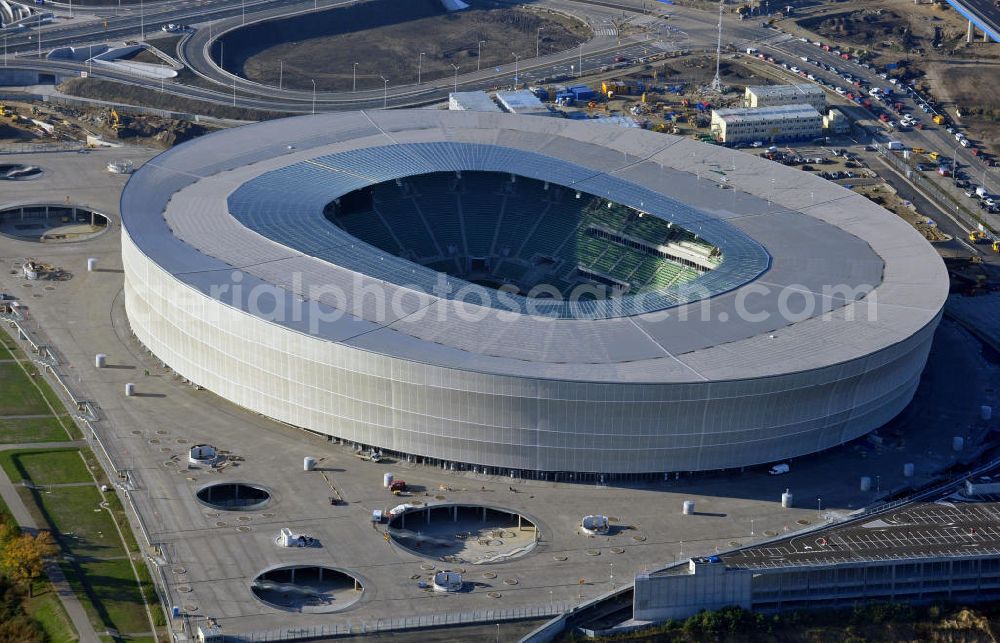 Wroclaw / Breslau from the bird's eye view: Das neu errichtete Stadion Miejski in Breslau, Niederschlesien in Polen. Das Fußballstadion ist ein Austragungsort der UEFA Fußball-Europameisterschaft EM 2012. Errichtet wurde der Stadion- Neubau durch das Bauunternehmen MAX Bögl nach Entwürfen des deutschen Architekturbüros JSK. The new built stadium Miejski in Wroclaw, Lower Silesia in Poland. The soccer stadium is a venue for the UEFA European Football Championship 2012. The stadium was built by the construction company Max Bögl designed by the German architects JSK.