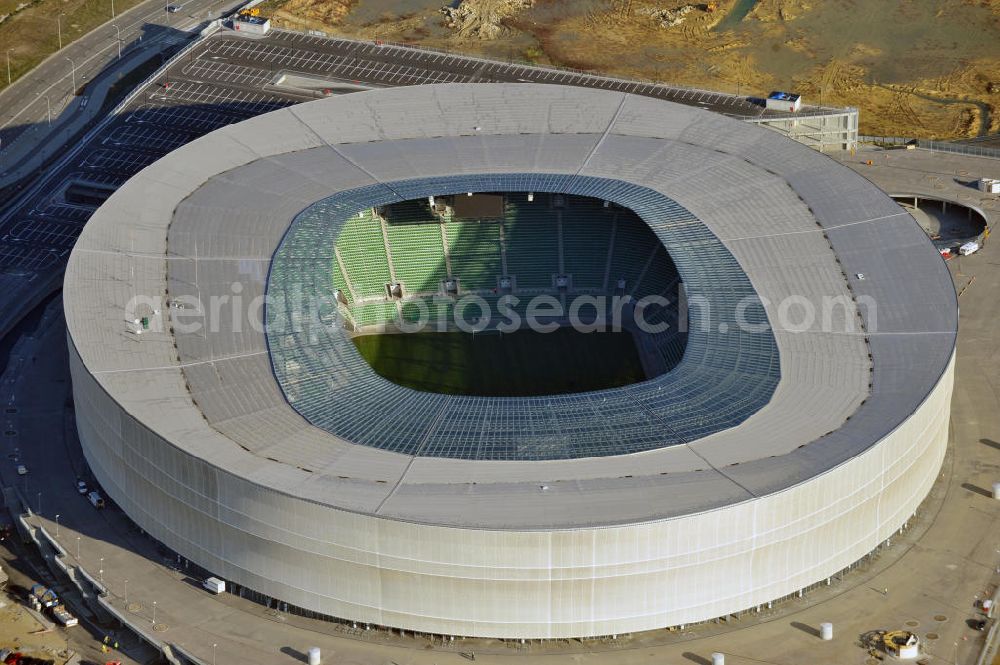 Aerial photograph Wroclaw / Breslau - Das neu errichtete Stadion Miejski in Breslau, Niederschlesien in Polen. Das Fußballstadion ist ein Austragungsort der UEFA Fußball-Europameisterschaft EM 2012. Errichtet wurde der Stadion- Neubau durch das Bauunternehmen MAX Bögl nach Entwürfen des deutschen Architekturbüros JSK. The new built stadium Miejski in Wroclaw, Lower Silesia in Poland. The soccer stadium is a venue for the UEFA European Football Championship 2012. The stadium was built by the construction company Max Bögl designed by the German architects JSK.