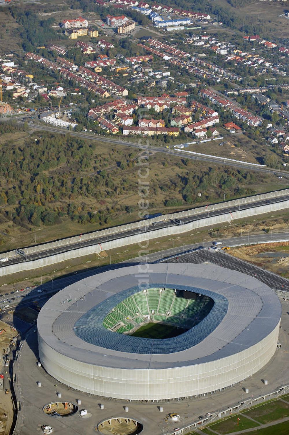 Aerial image Wroclaw / Breslau - Das neu errichtete Stadion Miejski in Breslau, Niederschlesien in Polen. Das Fußballstadion ist ein Austragungsort der UEFA Fußball-Europameisterschaft EM 2012. Errichtet wurde der Stadion- Neubau durch das Bauunternehmen MAX Bögl nach Entwürfen des deutschen Architekturbüros JSK. The new built stadium Miejski in Wroclaw, Lower Silesia in Poland. The soccer stadium is a venue for the UEFA European Football Championship 2012. The stadium was built by the construction company Max Bögl designed by the German architects JSK.