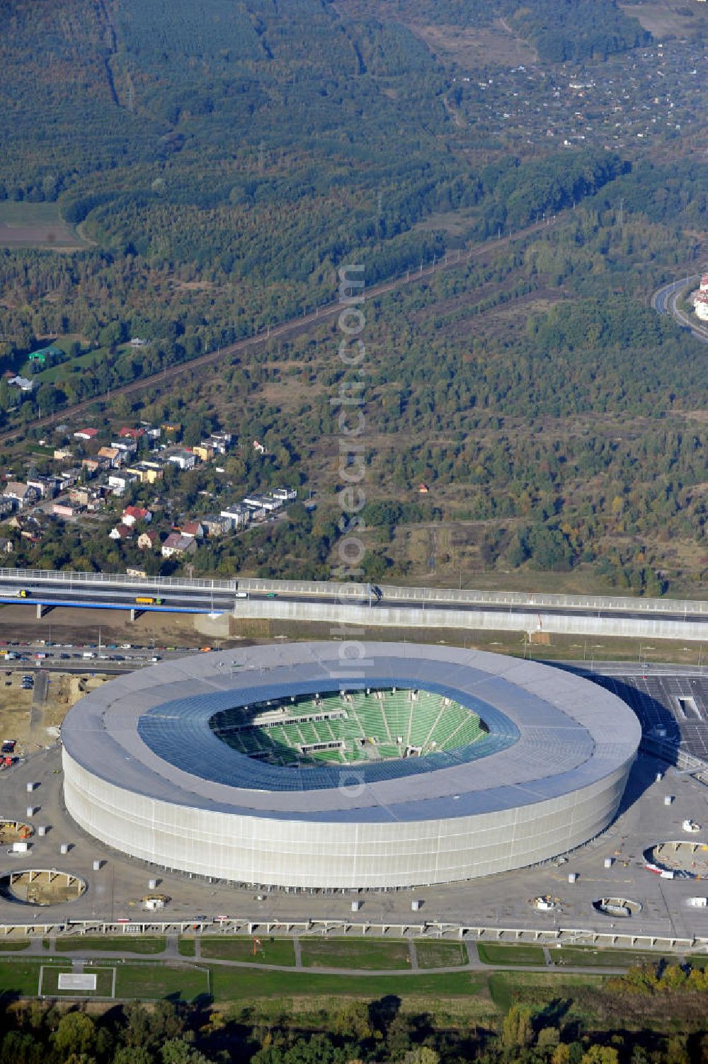 Wroclaw / Breslau from the bird's eye view: Das neu errichtete Stadion Miejski in Breslau, Niederschlesien in Polen. Das Fußballstadion ist ein Austragungsort der UEFA Fußball-Europameisterschaft EM 2012. Errichtet wurde der Stadion- Neubau durch das Bauunternehmen MAX Bögl nach Entwürfen des deutschen Architekturbüros JSK. The new built stadium Miejski in Wroclaw, Lower Silesia in Poland. The soccer stadium is a venue for the UEFA European Football Championship 2012. The stadium was built by the construction company Max Bögl designed by the German architects JSK.