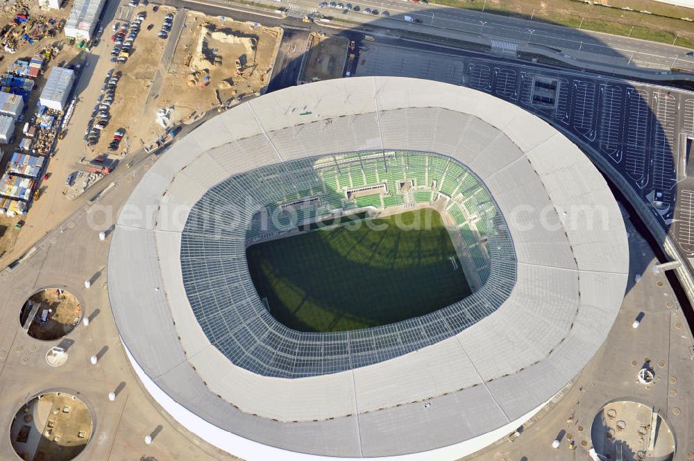 Wroclaw / Breslau from the bird's eye view: Das neu errichtete Stadion Miejski in Breslau, Niederschlesien in Polen. Das Fußballstadion ist ein Austragungsort der UEFA Fußball-Europameisterschaft EM 2012. Errichtet wurde der Stadion- Neubau durch das Bauunternehmen MAX Bögl nach Entwürfen des deutschen Architekturbüros JSK. The new built stadium Miejski in Wroclaw, Lower Silesia in Poland. The soccer stadium is a venue for the UEFA European Football Championship 2012. The stadium was built by the construction company Max Bögl designed by the German architects JSK.