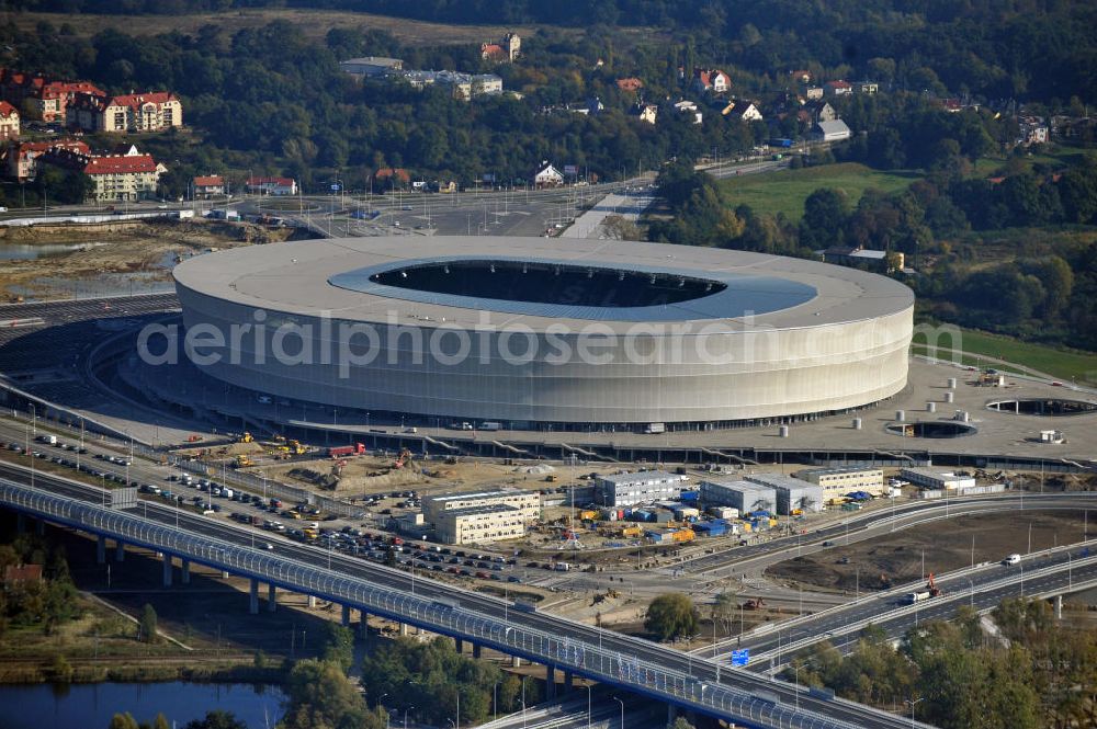 Wroclaw / Breslau from the bird's eye view: Das neu errichtete Stadion Miejski in Breslau, Niederschlesien in Polen. Das Fußballstadion ist ein Austragungsort der UEFA Fußball-Europameisterschaft EM 2012. Errichtet wurde der Stadion- Neubau durch das Bauunternehmen MAX Bögl nach Entwürfen des deutschen Architekturbüros JSK. The new built stadium Miejski in Wroclaw, Lower Silesia in Poland. The soccer stadium is a venue for the UEFA European Football Championship 2012. The stadium was built by the construction company Max Bögl designed by the German architects JSK.