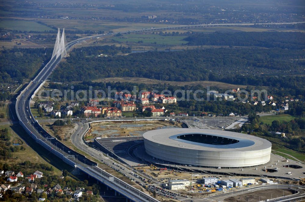 Wroclaw / Breslau from the bird's eye view: Das neu errichtete Stadion Miejski in Breslau, Niederschlesien in Polen. Das Fußballstadion ist ein Austragungsort der UEFA Fußball-Europameisterschaft EM 2012. Errichtet wurde der Stadion- Neubau durch das Bauunternehmen MAX Bögl nach Entwürfen des deutschen Architekturbüros JSK. The new built stadium Miejski in Wroclaw, Lower Silesia in Poland. The soccer stadium is a venue for the UEFA European Football Championship 2012. The stadium was built by the construction company Max Bögl designed by the German architects JSK.