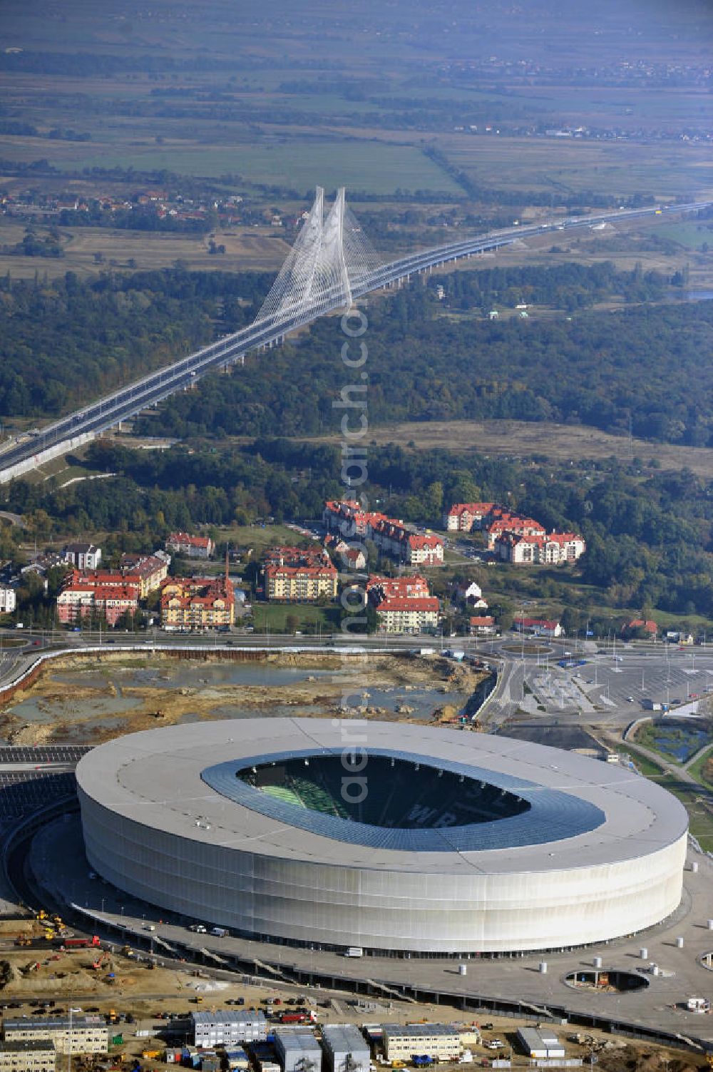 Aerial photograph Wroclaw / Breslau - Das neu errichtete Stadion Miejski in Breslau, Niederschlesien in Polen. Das Fußballstadion ist ein Austragungsort der UEFA Fußball-Europameisterschaft EM 2012. Errichtet wurde der Stadion- Neubau durch das Bauunternehmen MAX Bögl nach Entwürfen des deutschen Architekturbüros JSK. The new built stadium Miejski in Wroclaw, Lower Silesia in Poland. The soccer stadium is a venue for the UEFA European Football Championship 2012. The stadium was built by the construction company Max Bögl designed by the German architects JSK.