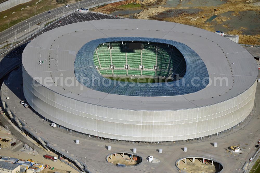 Wroclaw / Breslau from the bird's eye view: Das neu errichtete Stadion Miejski in Breslau, Niederschlesien in Polen. Das Fußballstadion ist ein Austragungsort der UEFA Fußball-Europameisterschaft EM 2012. Errichtet wurde der Stadion- Neubau durch das Bauunternehmen MAX Bögl nach Entwürfen des deutschen Architekturbüros JSK. The new built stadium Miejski in Wroclaw, Lower Silesia in Poland. The soccer stadium is a venue for the UEFA European Football Championship 2012. The stadium was built by the construction company Max Bögl designed by the German architects JSK.