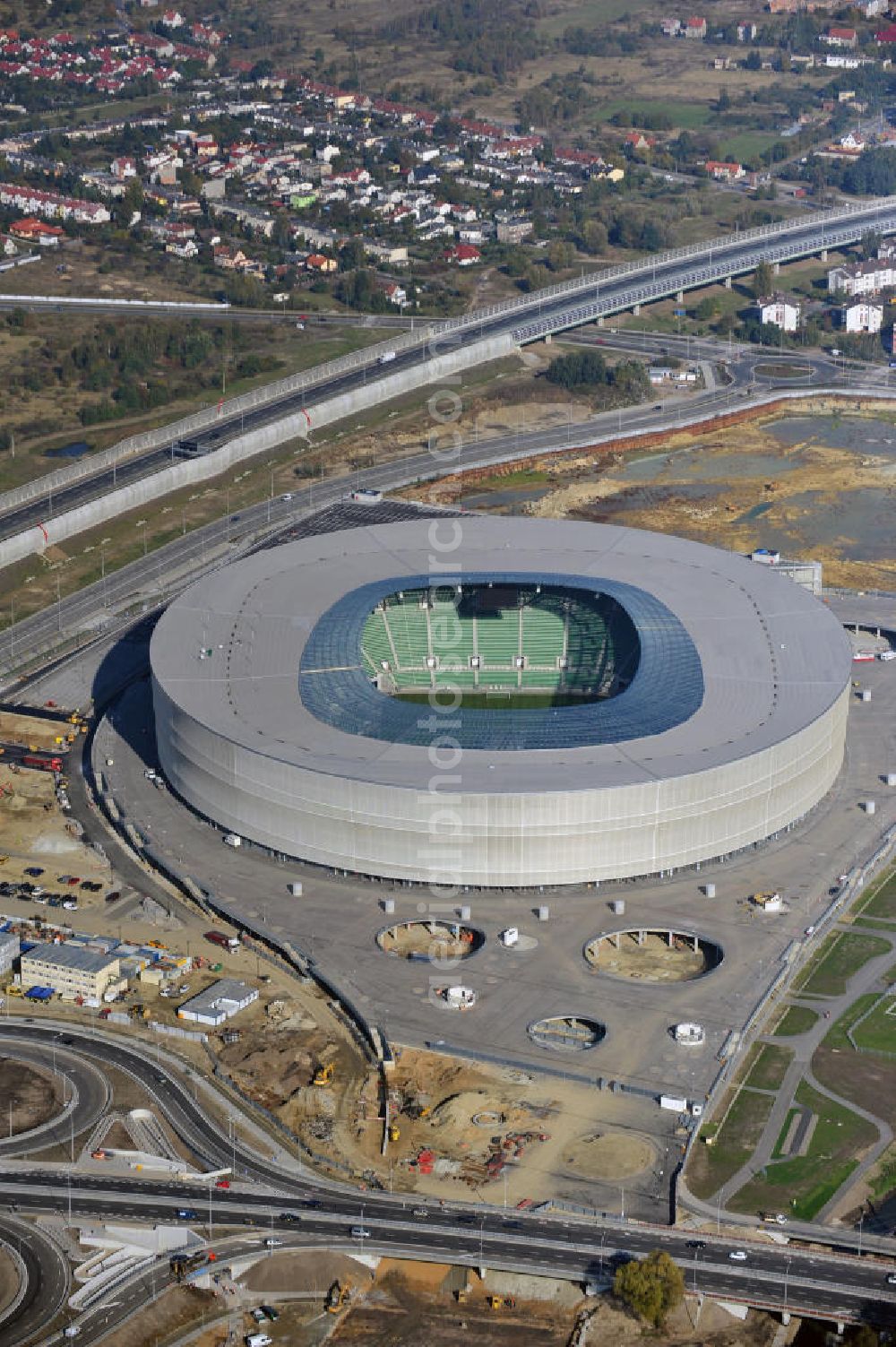 Aerial image Wroclaw / Breslau - Das neu errichtete Stadion Miejski in Breslau, Niederschlesien in Polen. Das Fußballstadion ist ein Austragungsort der UEFA Fußball-Europameisterschaft EM 2012. Errichtet wurde der Stadion- Neubau durch das Bauunternehmen MAX Bögl nach Entwürfen des deutschen Architekturbüros JSK. The new built stadium Miejski in Wroclaw, Lower Silesia in Poland. The soccer stadium is a venue for the UEFA European Football Championship 2012. The stadium was built by the construction company Max Bögl designed by the German architects JSK.