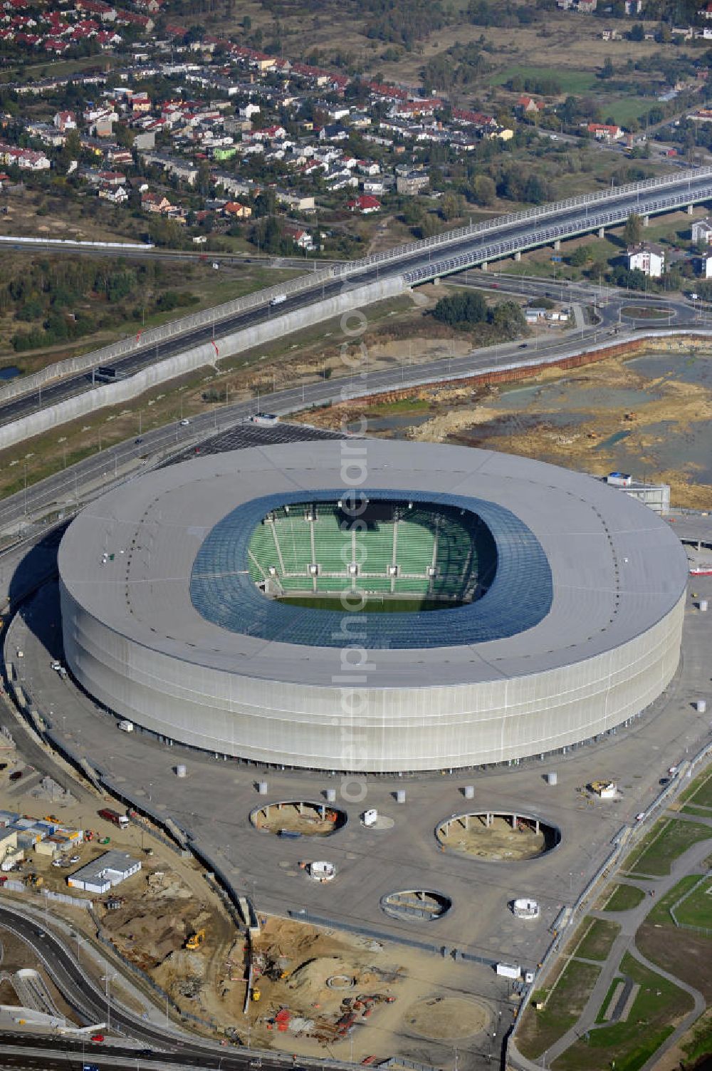 Aerial photograph Wroclaw / Breslau - Das neu errichtete Stadion Miejski in Breslau, Niederschlesien in Polen. Das Fußballstadion ist ein Austragungsort der UEFA Fußball-Europameisterschaft EM 2012. Errichtet wurde der Stadion- Neubau durch das Bauunternehmen MAX Bögl nach Entwürfen des deutschen Architekturbüros JSK. The new built stadium Miejski in Wroclaw, Lower Silesia in Poland. The soccer stadium is a venue for the UEFA European Football Championship 2012. The stadium was built by the construction company Max Bögl designed by the German architects JSK.