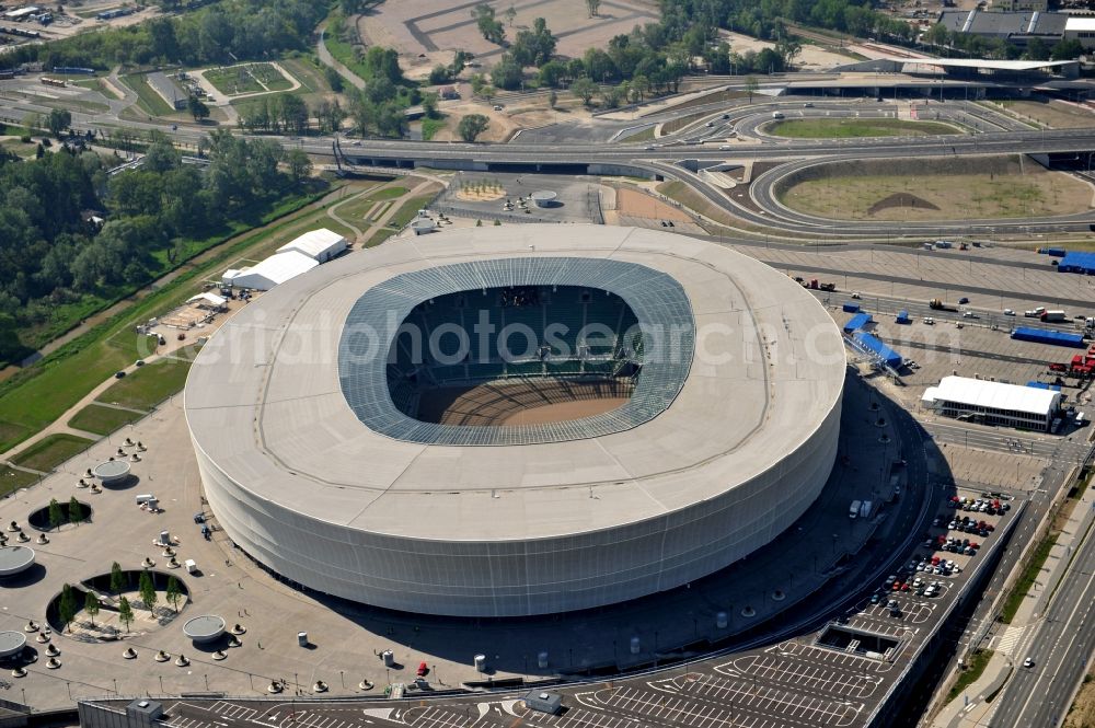 Wroclaw / Breslau from the bird's eye view: Blick auf das Stadion Miejski in Breslau, Niederschlesien in Polen. Das Fußballstadion ist ein Austragungsort der UEFA Fußball-Europameisterschaft EM 2012. Errichtet wurde der Stadion- Neubau durch das Bauunternehmen MAX Bögl nach Entwürfen des deutschen Architekturbüros JSK. The new built stadium Miejski in Wroclaw, Lower Silesia in Poland. The soccer stadium is a venue for the UEFA European Football Championship 2012. The stadium was built by the construction company Max Bögl designed by the German architects JSK.