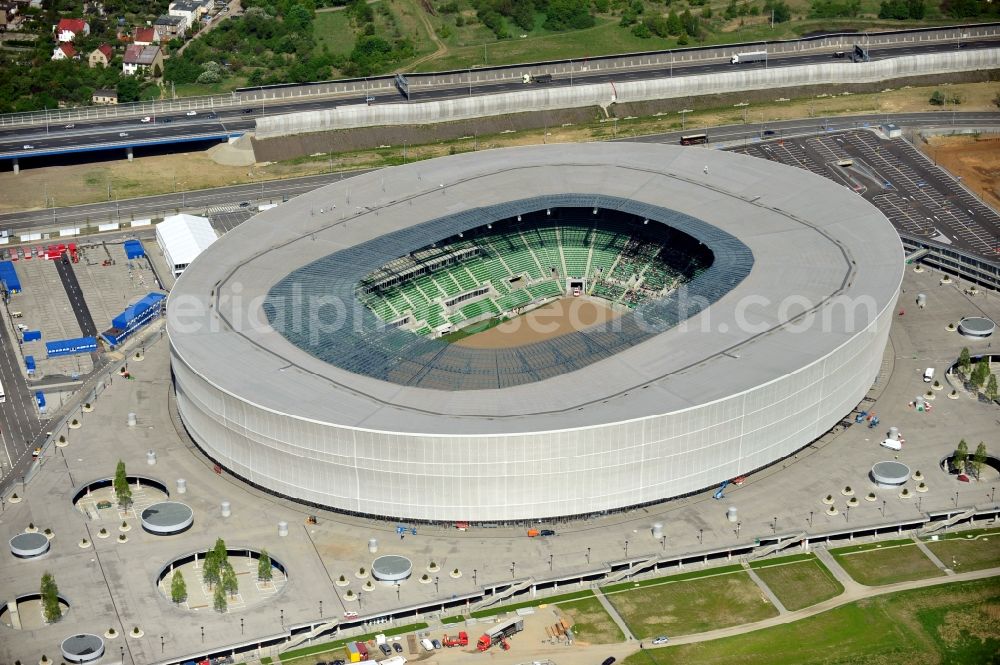 Wroclaw / Breslau from the bird's eye view: Blick auf das Stadion Miejski in Breslau, Niederschlesien in Polen. Das Fußballstadion ist ein Austragungsort der UEFA Fußball-Europameisterschaft EM 2012. Errichtet wurde der Stadion- Neubau durch das Bauunternehmen MAX Bögl nach Entwürfen des deutschen Architekturbüros JSK. The new built stadium Miejski in Wroclaw, Lower Silesia in Poland. The soccer stadium is a venue for the UEFA European Football Championship 2012. The stadium was built by the construction company Max Bögl designed by the German architects JSK.