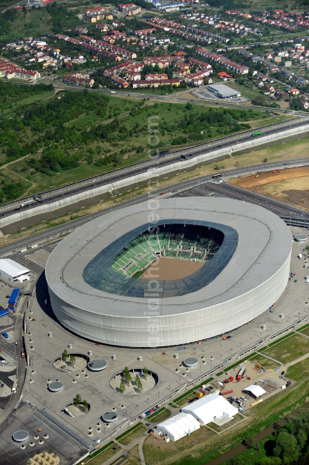 Aerial photograph Wroclaw / Breslau - Blick auf das Stadion Miejski in Breslau, Niederschlesien in Polen. Das Fußballstadion ist ein Austragungsort der UEFA Fußball-Europameisterschaft EM 2012. Errichtet wurde der Stadion- Neubau durch das Bauunternehmen MAX Bögl nach Entwürfen des deutschen Architekturbüros JSK. The new built stadium Miejski in Wroclaw, Lower Silesia in Poland. The soccer stadium is a venue for the UEFA European Football Championship 2012. The stadium was built by the construction company Max Bögl designed by the German architects JSK.