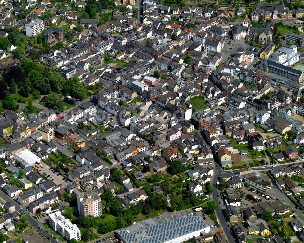 Bendorf from the bird's eye view: View of the town of Bendorf in the state of Rhineland-Palatinate. The town is located in the county district of Mayen-Koblenz on the right riverbank of the river Rhine. The town is an official tourist resort and is located on the German Limes Road. It consists of the four parts Bendorf, Sayn, Muelhofen and Stromberg. The federal highway B42 takes its course through the town and meets the federal motorway A48 in the South of the town