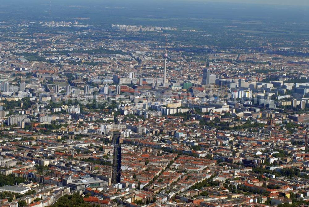 Berlin from above - Blick über Berlin und auf den Fernsehturm. Seit dem 07. November 2005 verwandelten bis zu 20 Industriekletterer die Besucherkuppel des Berliner Fernsehturms in das spektakulärste Wahrzeichen der Fußball-Weltmeisterschaft. Gestaltet wird es von der Deutschen Telekom, dem Hauptsponsor der WM.