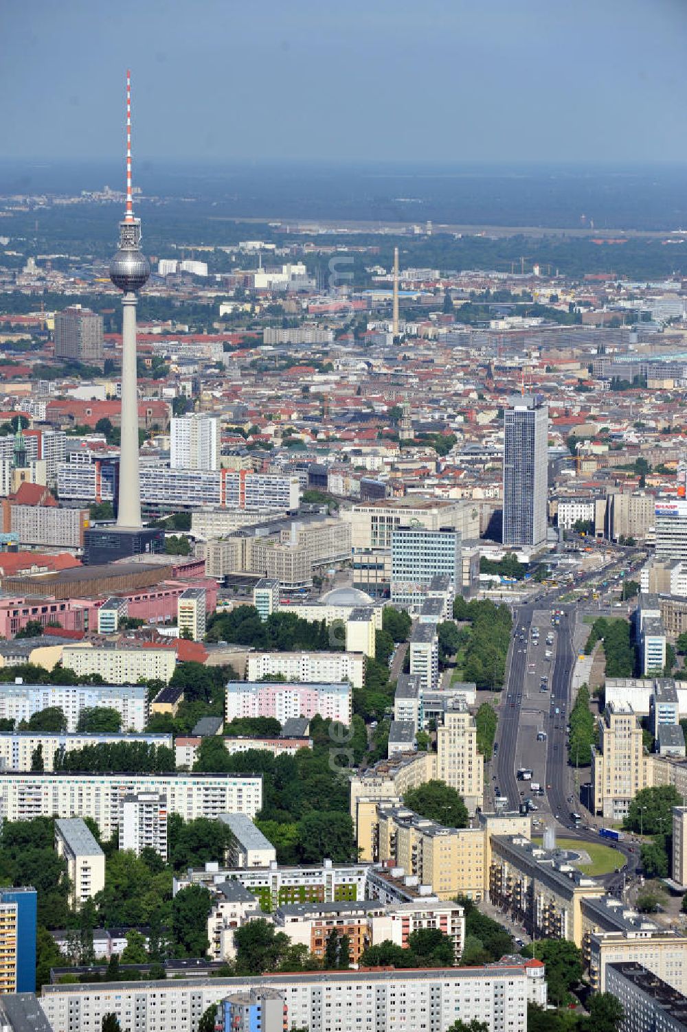 Aerial image Berlin Mitte - Stadtansicht entlang der Karl-Marx-Allee mit dem Strausberger Platz in Richtung Berlin-Mitte mit Fernsehturm am Alexanderplatz. Townscape along the street Karl-Marx-Allee with the square Strausbergerplatz in the direction to the TV tower at the public square Alexanderplatz.