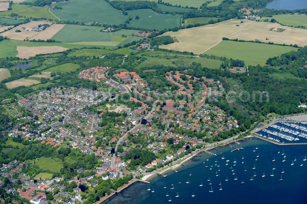 Aerial photograph Eckernförde - City view of the city area of Eckernfoerde and a nearby port aswell as surrounding fields at the coastline of the baltic sea in the state Schleswig-Holstein in Germany