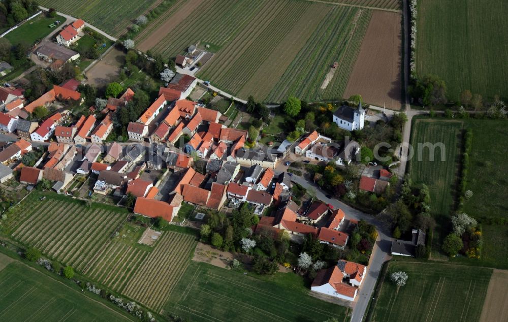 Aerial image Esselborn - City view of Esselborn in the district Alzey Worms in the state of Rhineland-Palatinate. On the edge of town lies a protestant church in baroque / perpendicular style, formerly St. Peter. The church building is a cultural monument