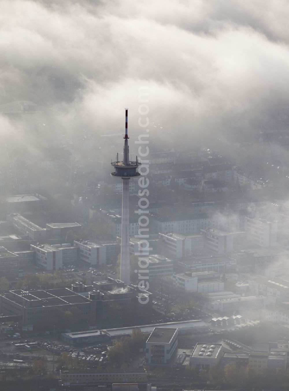 Aerial image Essen - Cityscape with a view of the telecommunication tower coated with fog and an impressive cloud bank over the city center of Essen in the state North Rhine-Westphalia. The autumn weather clouds are surrounding the television tower at its location in the Holsterhausen district and form a thick cover over the Ruhr region city